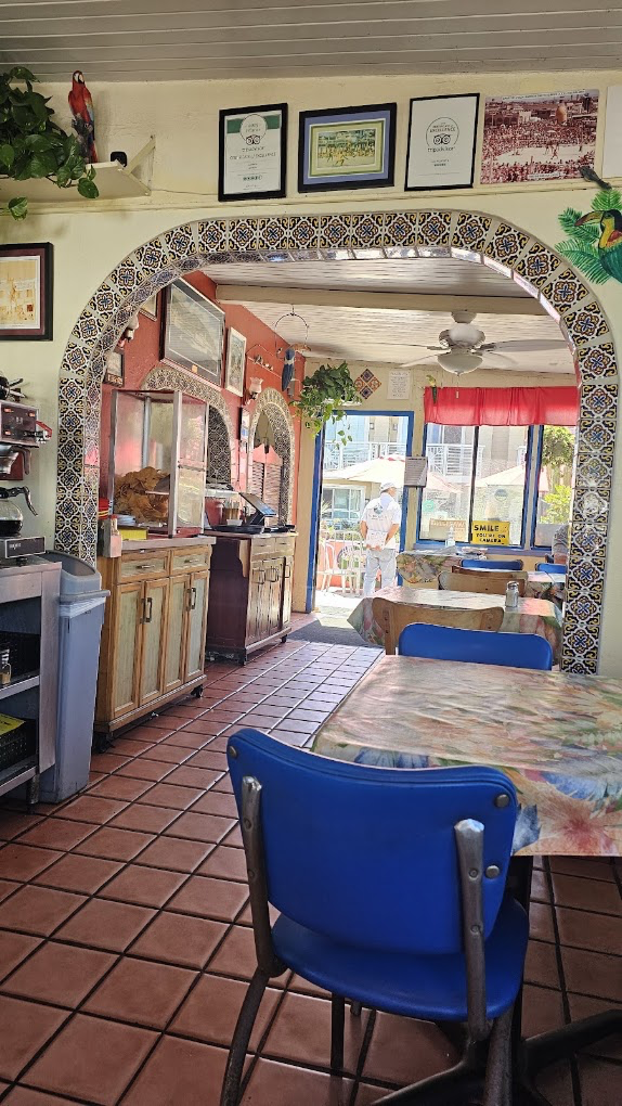 Colorful tiled arch inside La Playita Cafe